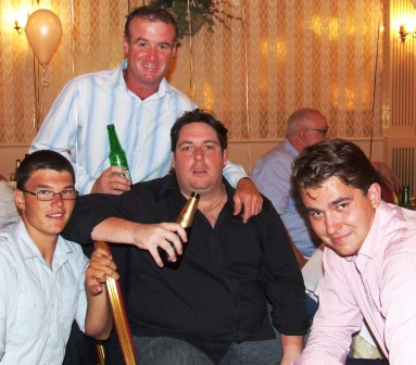 Sean O'Kane stands behind the Pride of the Fifths: L-R Beau Velona, who took a five-wicket haul the day after the 40th, team manager Ryan Fairclough and Fifths captain Jesse Nankivell-Sandor.